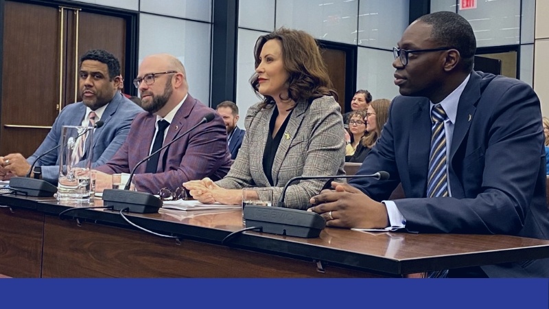 Governor Gretchen Whitmer sitting on panel.