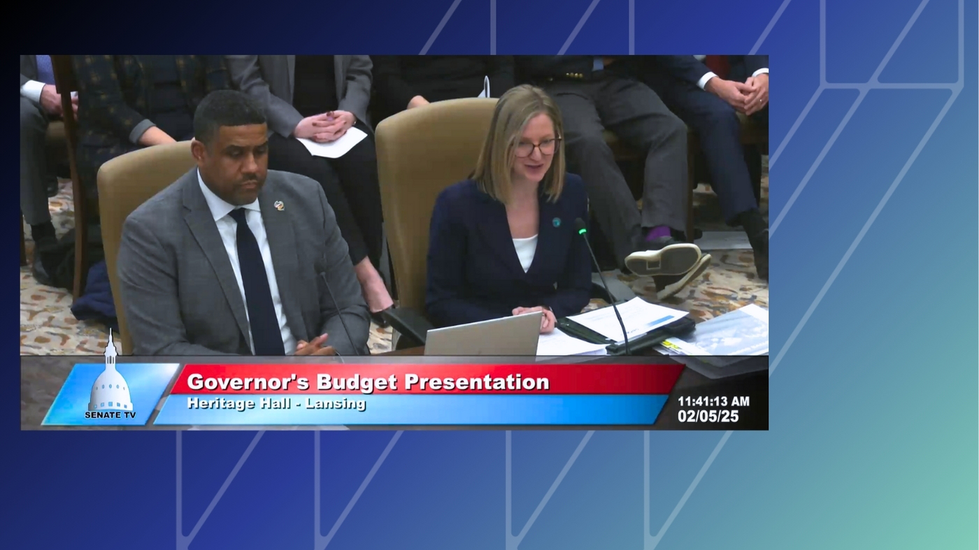 State Budget Director Jen Flood and Deputy State Budget Director Kyle Guerrant presenting Gov. Gretchen Whitmer’s fiscal year 2026 budget proposal